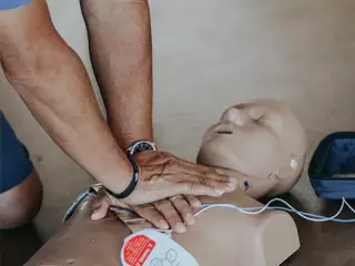 person practicing CPR